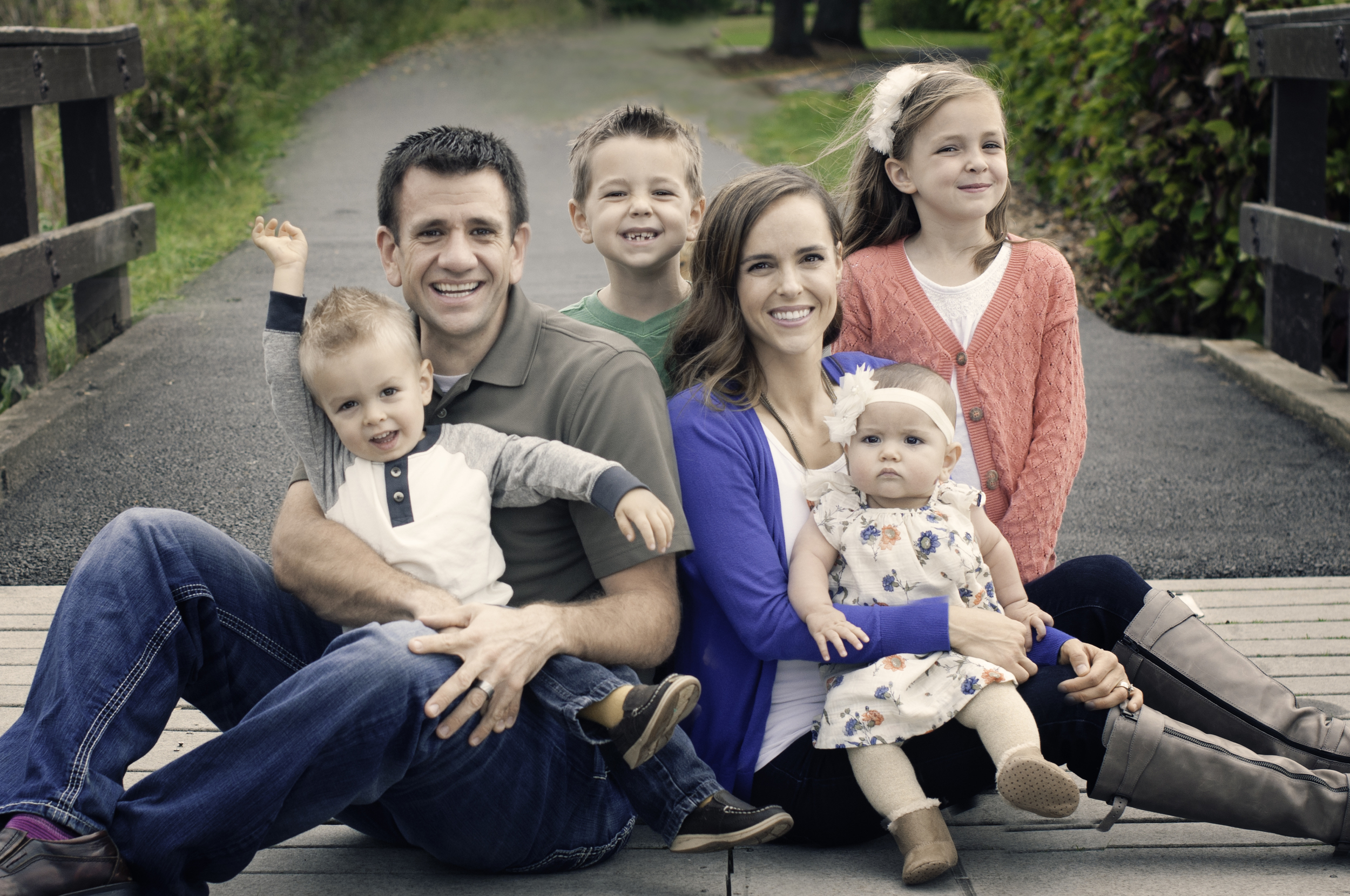 McBride Family-sitting on the bridge.jpg