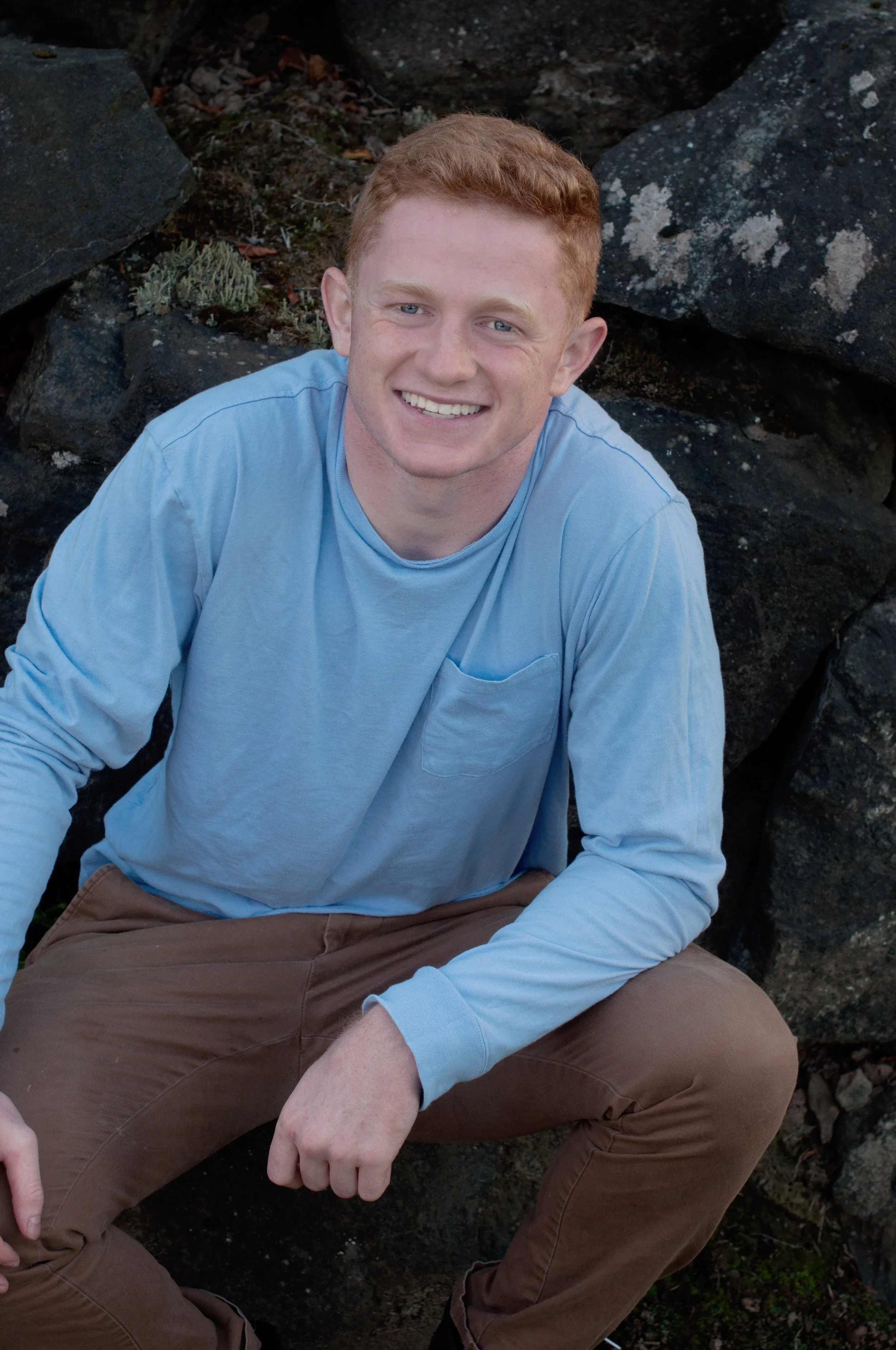 Levi blue shirt in front of rocks.jpg