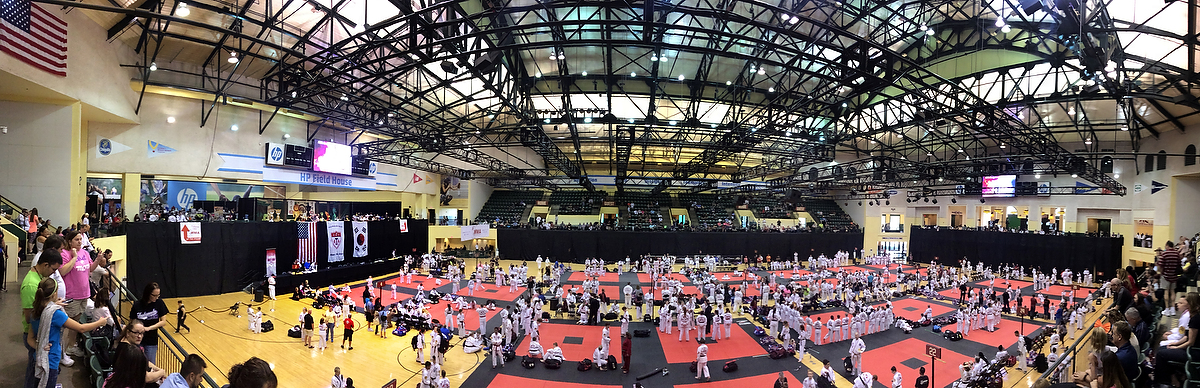 A panoramic photo of 2015 ATA Fall Nationals in Orlando, FL. Whew! This perspective illustrates the whirlwind adventure of energy and emotion seen from the eyes of a photographer competitor, a 4th degree mid-term tester, and a judge for three different rings (including girls black belt creative and XMA forms and weapons, black belt mens 17-29, and black belt women 17-29)! 