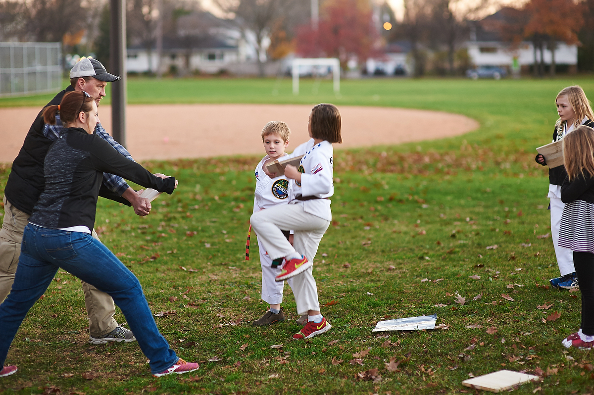 Sylvi, a lakes martial arts leadership team member, offers tyler a few tips on breaking his board (she's an expert)!