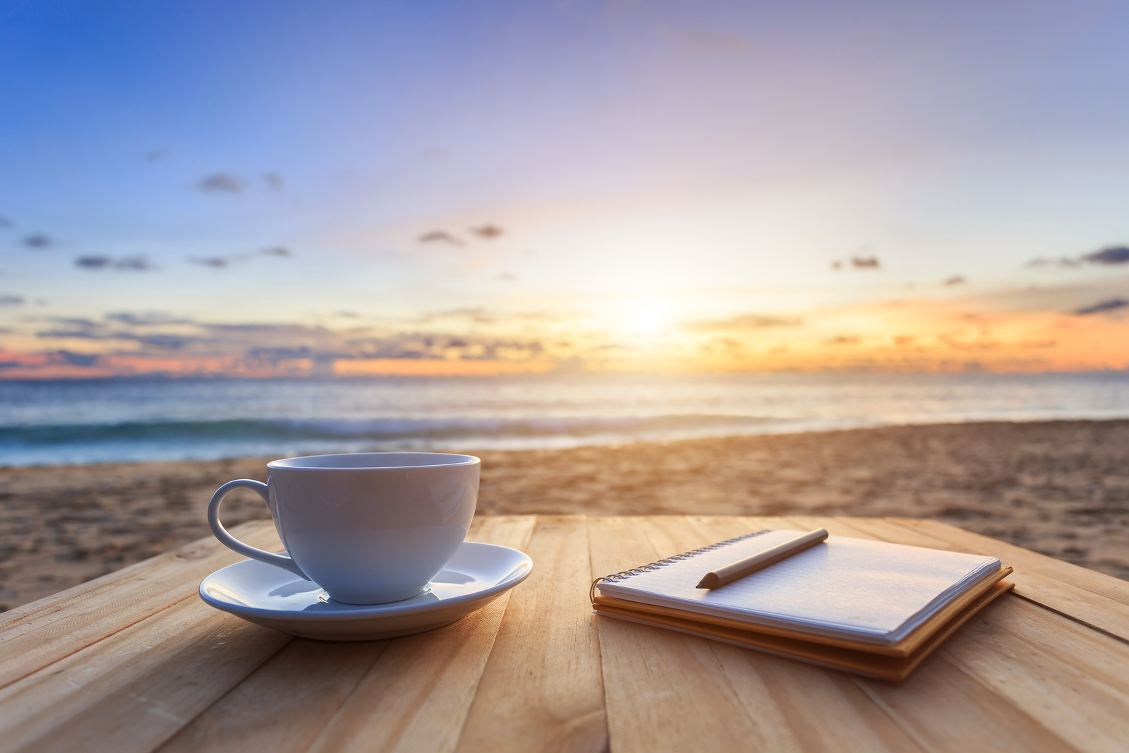 bigstock-Coffee-Cup-On-Wood-Table-At-Su-93388991.jpg