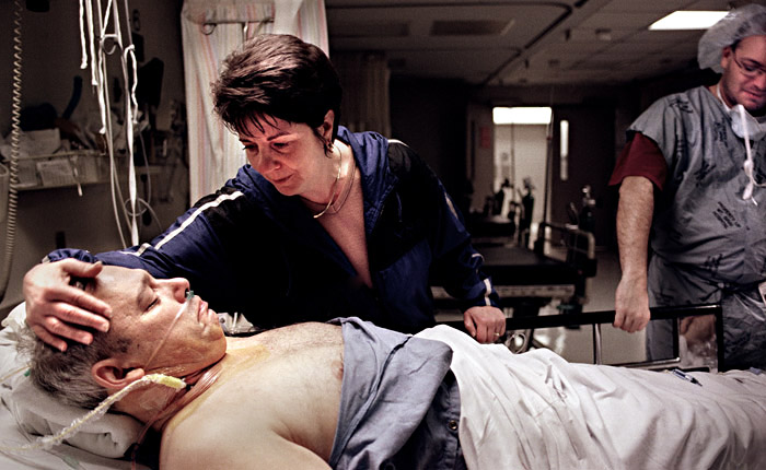 Comforted by his wife, Joe is prepped for his transplant. In America, the median wait for a heart is 209 days, with the success rates of patients living longer than 5 years hovering near 50%.