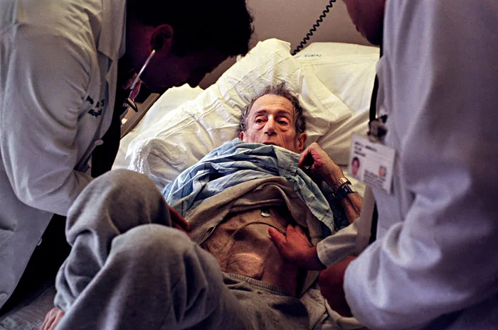 Technically too old and too thin to be on the transplant list, Saul is also too ill to go home. Here, Saul's doctors are inspecting his condition, and point out that his LVAD (an assist device for his failed heart valves) was visible beneath his skin.