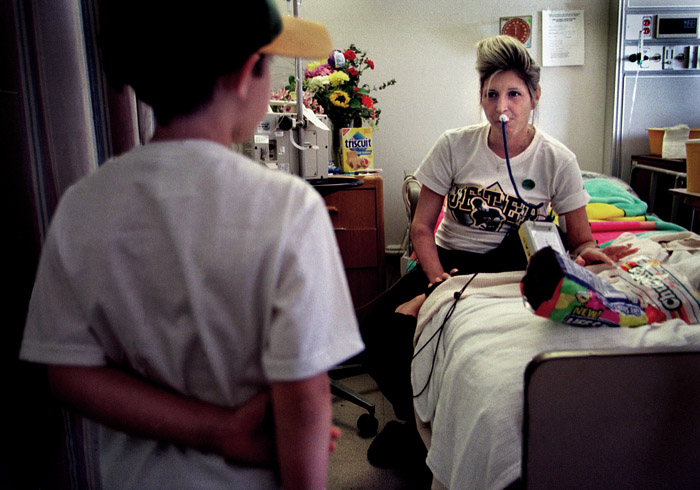 Lisa's son visits her in the hospital. With a very common blood type and her age, Lisa's chances are pretty good to get a heart, and her wait was relatively short, only four months.