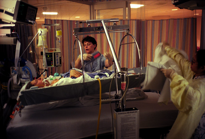 Post-op, Lisa is taken to a recovery room, and placed in a warming bed to regulate her temperature.