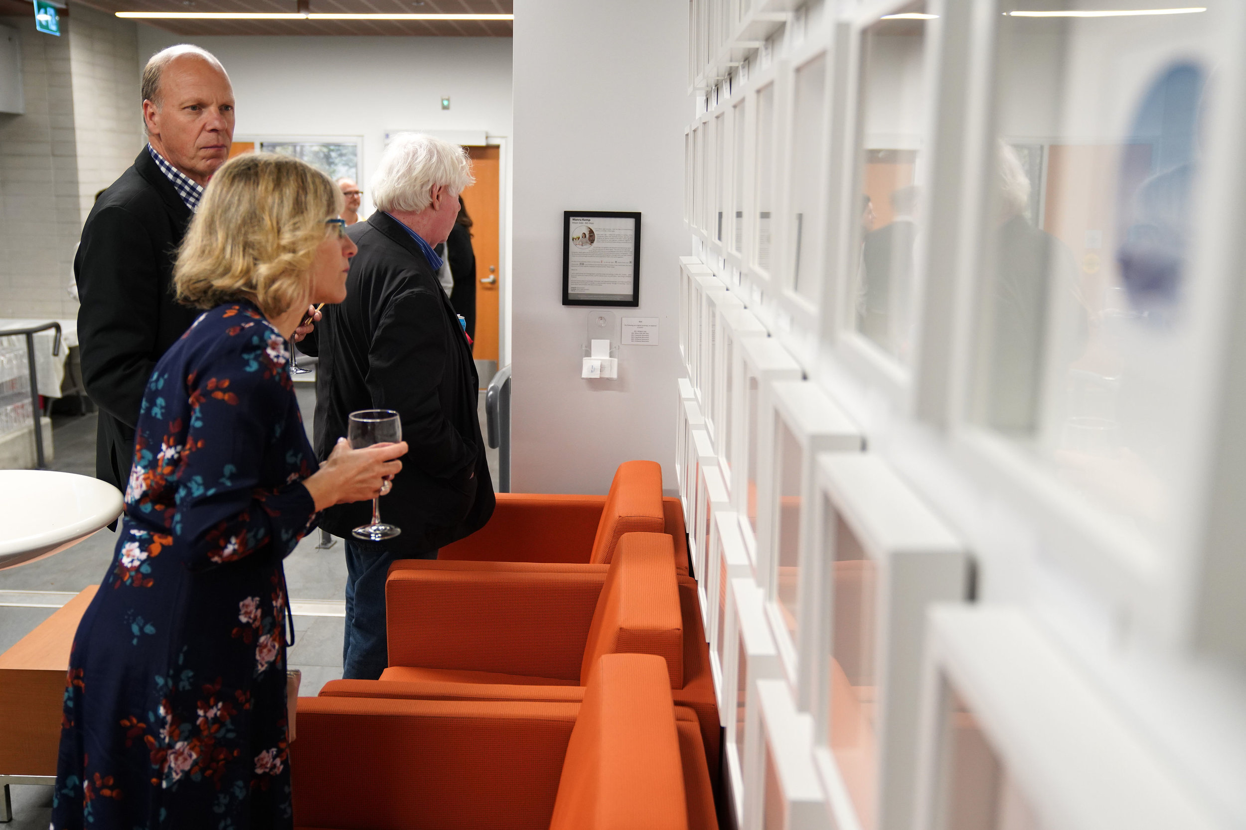  FANS Sponsor Stan Van Woerkens and guests view the art display 