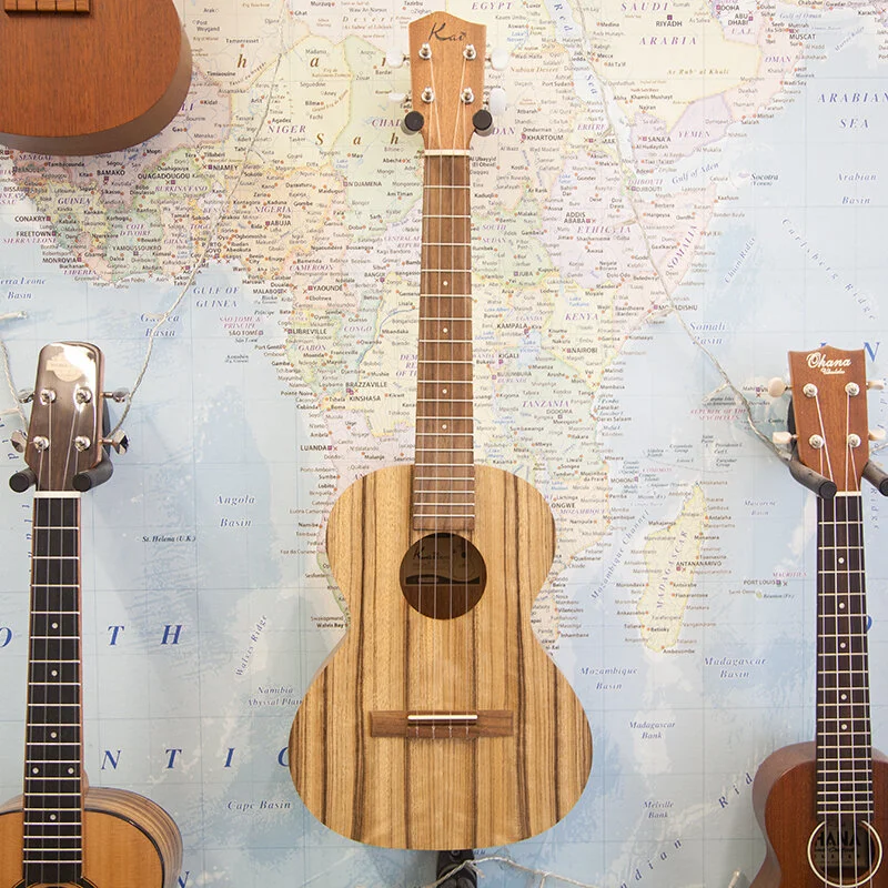 Kala KA-PWT Pacific Walnut Tenor Ukulele Kala Ukes Ukulele The Pacific Walnut ukes feature rich, dark brown grain patterns against a light brown body. Their sound is crisp with a focused, clear