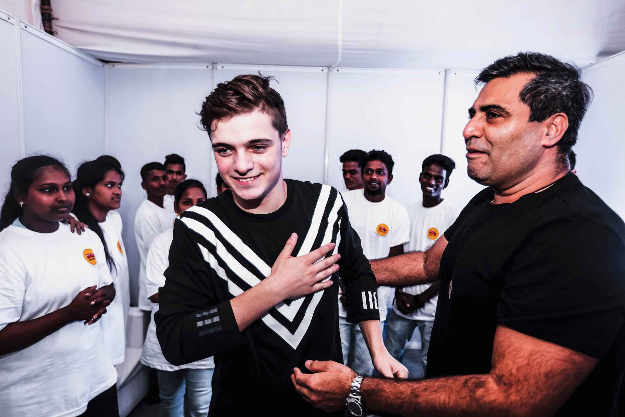 Martin Garrix and Shailendra Singh meeting the Magic Bus children