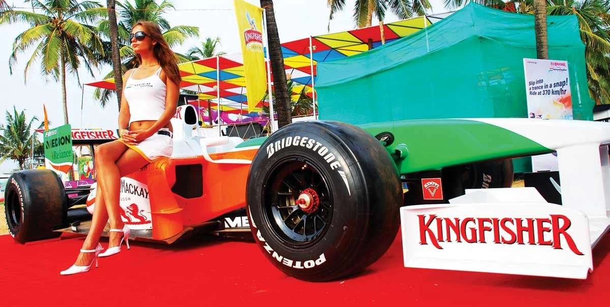 Model sits on custom Kingfisher F1 race car