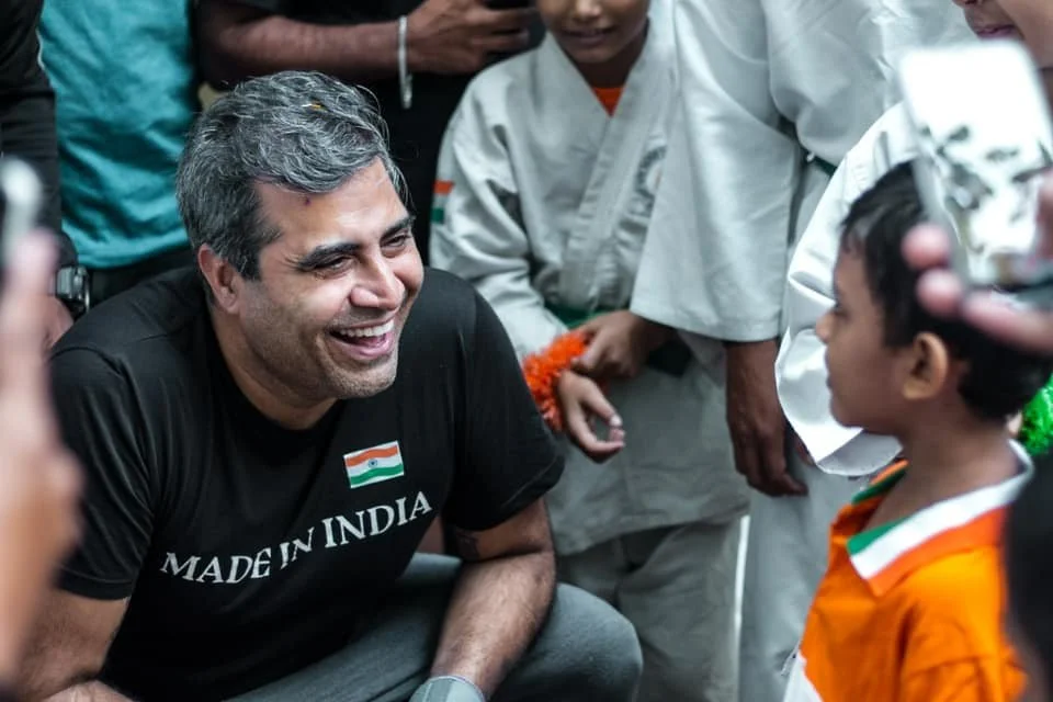 Shailendra Singh with a child at the Made in India philanthropy initiative
