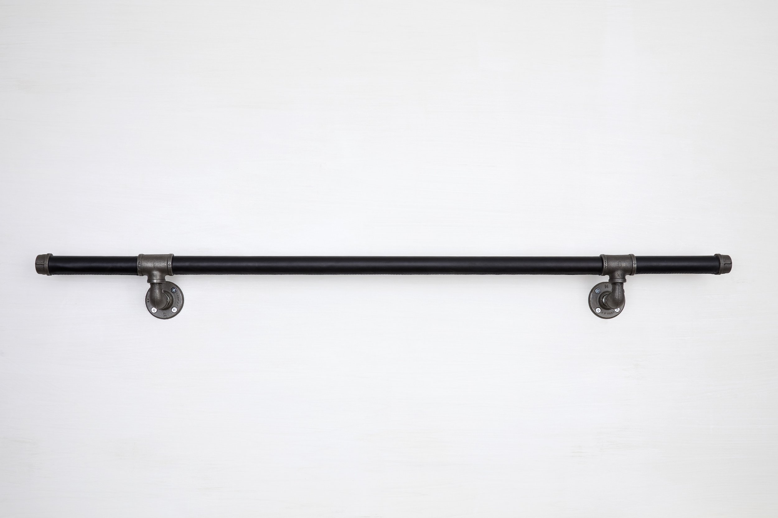 Black leather handrail wall mounted with industrial stainless steel supports