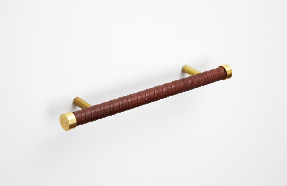 Solid brass handle wrapped in strips of brown leather