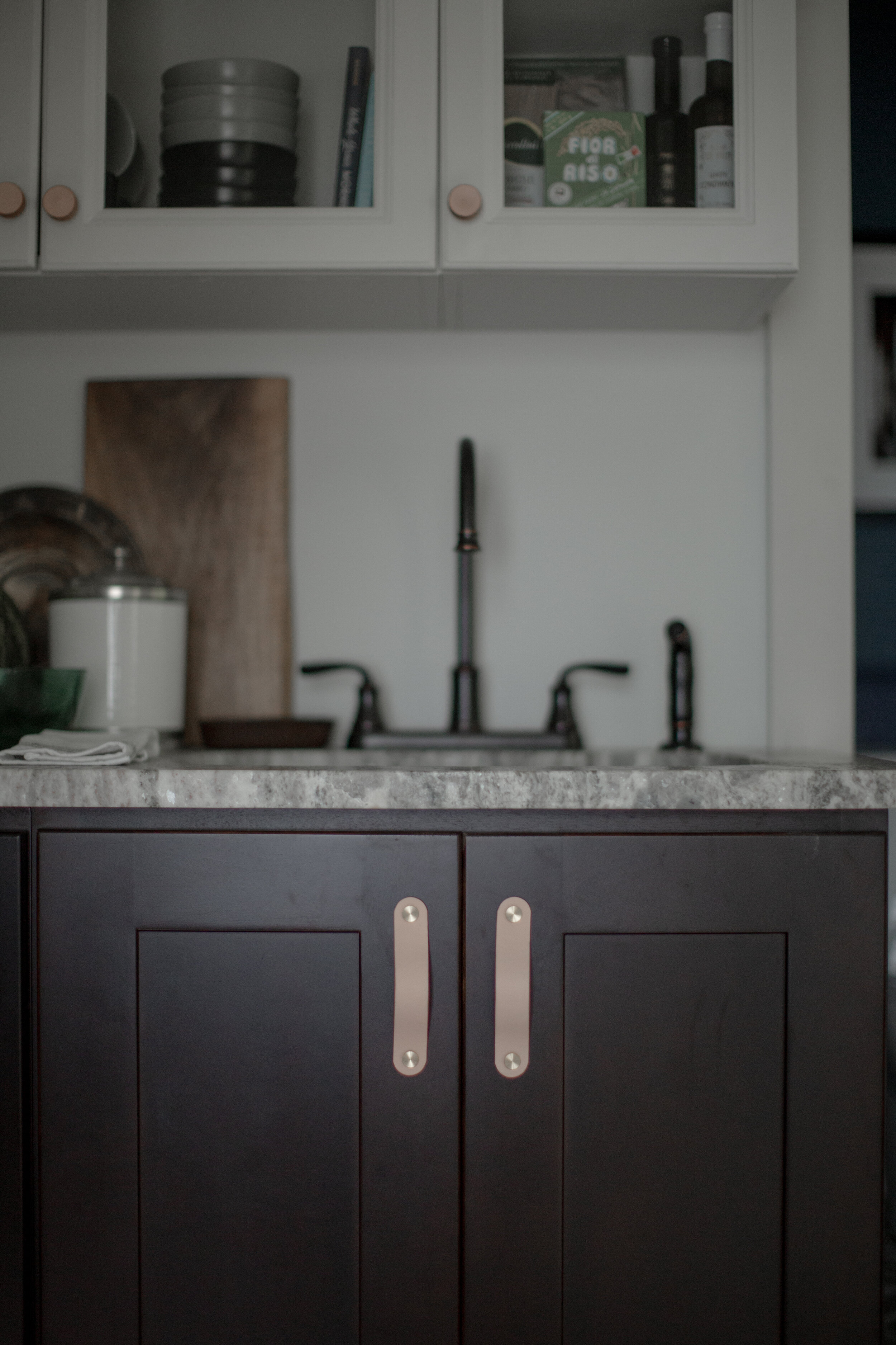 Natural skirting leather pull shown on kitchen cabinet door