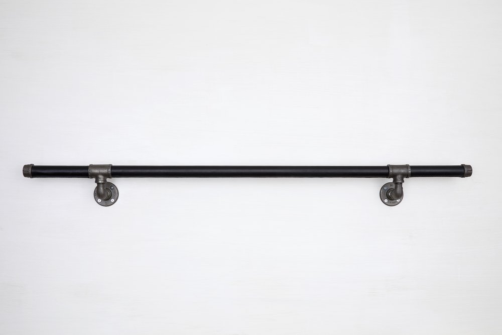 Wall mounted black leather handrail with industrial stainless steel supports