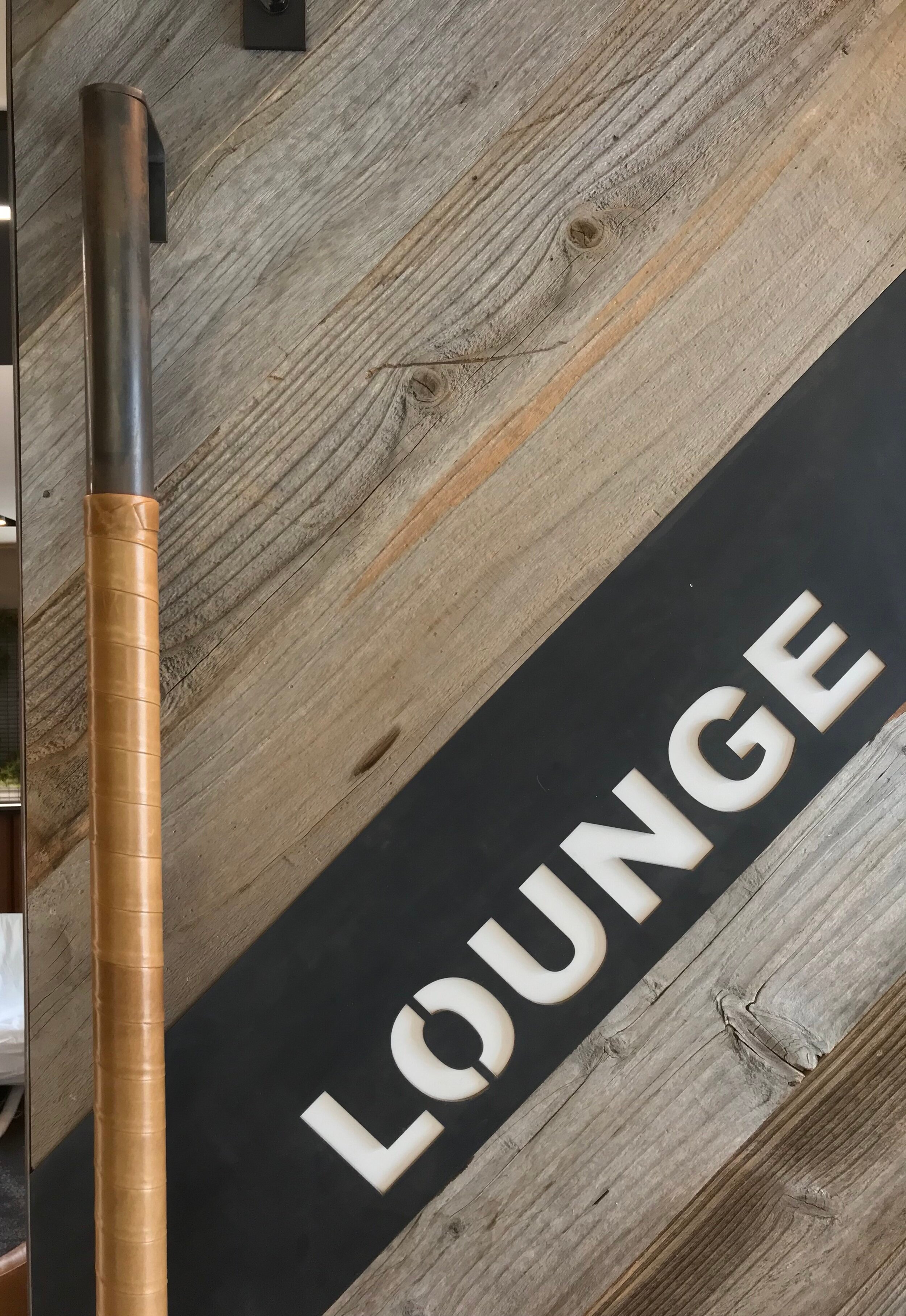 Close up of brown leather door pull on a lounge door