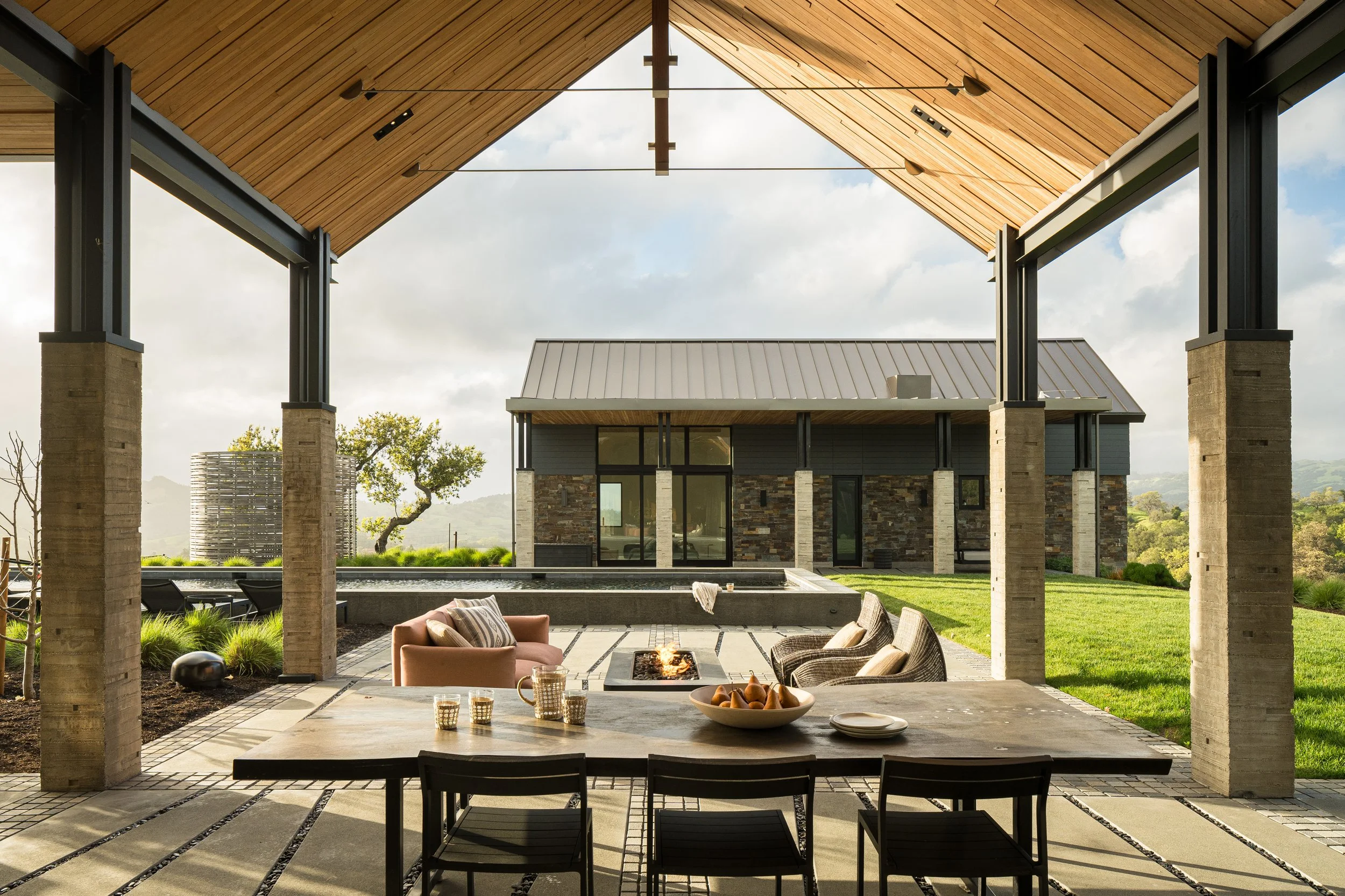  Looking across outdoor room towards the pool house  