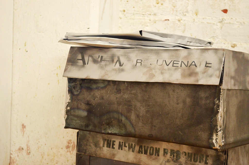  Replicas of Avon merchandise packaging found in the home of artist's grandmother. Forged and welded sheet steel and steel wire.&nbsp; 