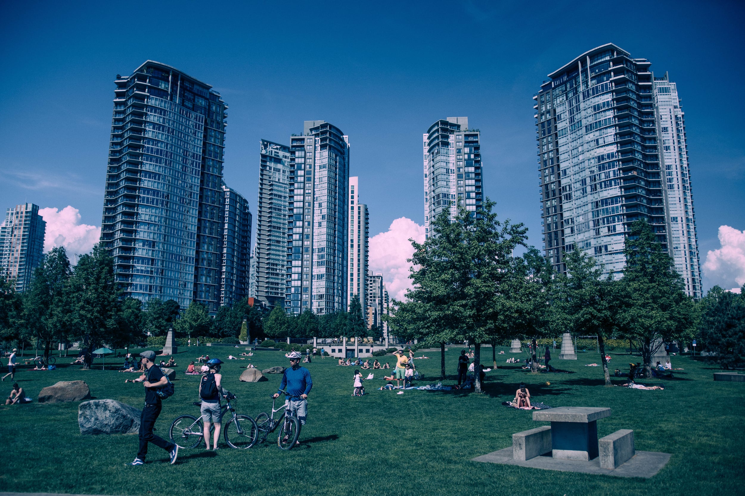 A typical parkscape: children frolic and adults watch while urbanity and nature harmonize.