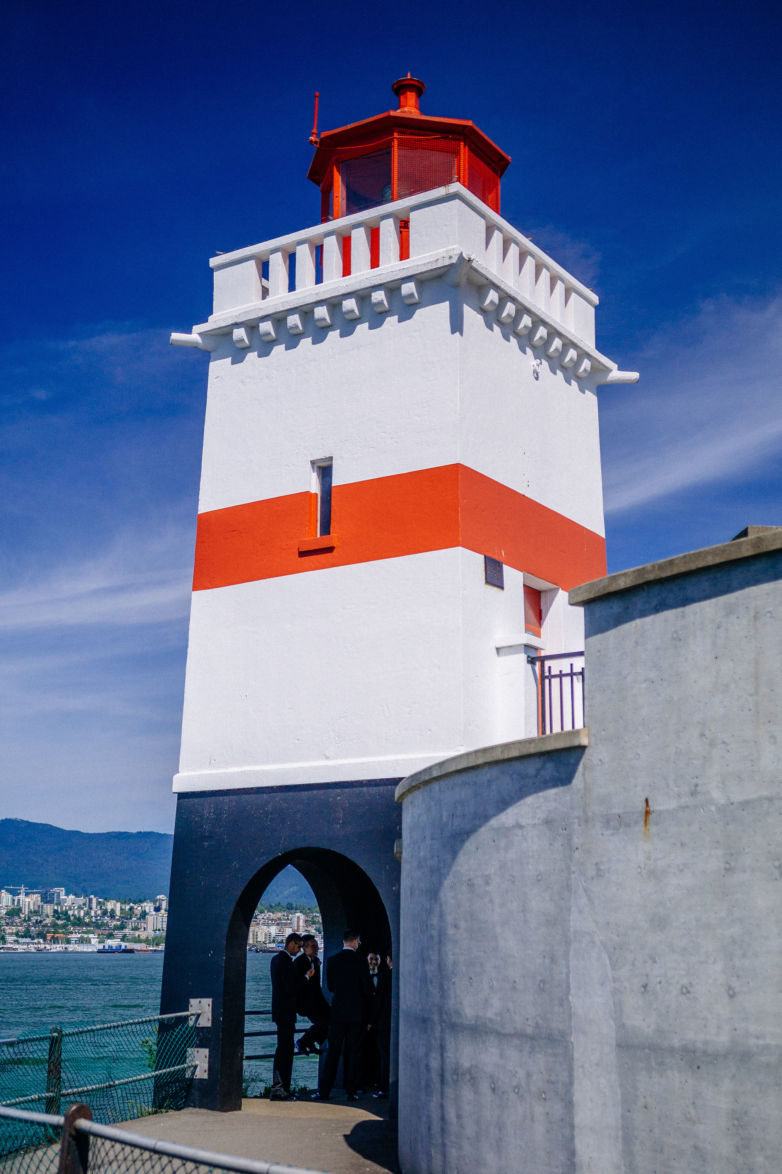 The secret congregation deliberates beneath the lighthouse. 