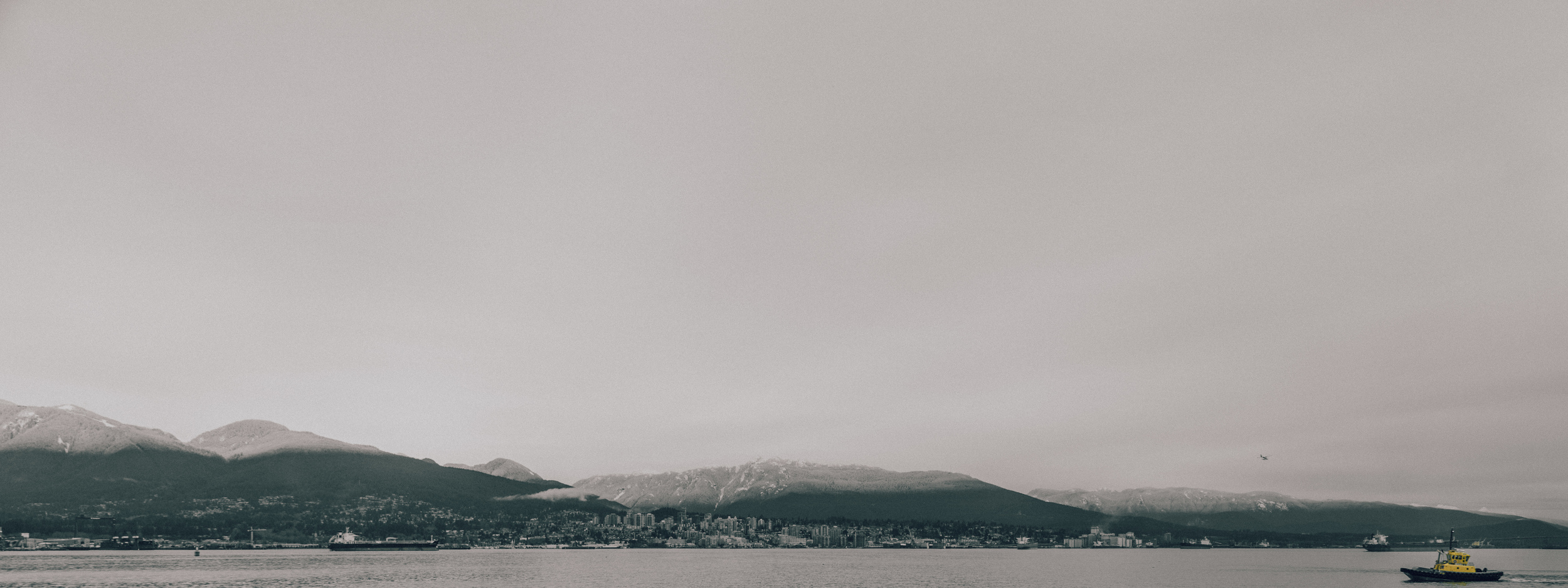 The small yellow steamboat stumbles its way across the salty sea.