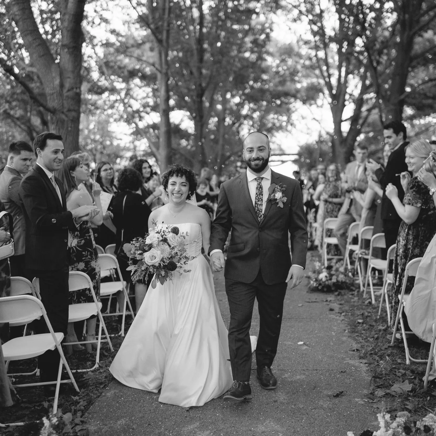 Emotional wedding ceremony vows moment photographed at OSRUI near Milwaukee.