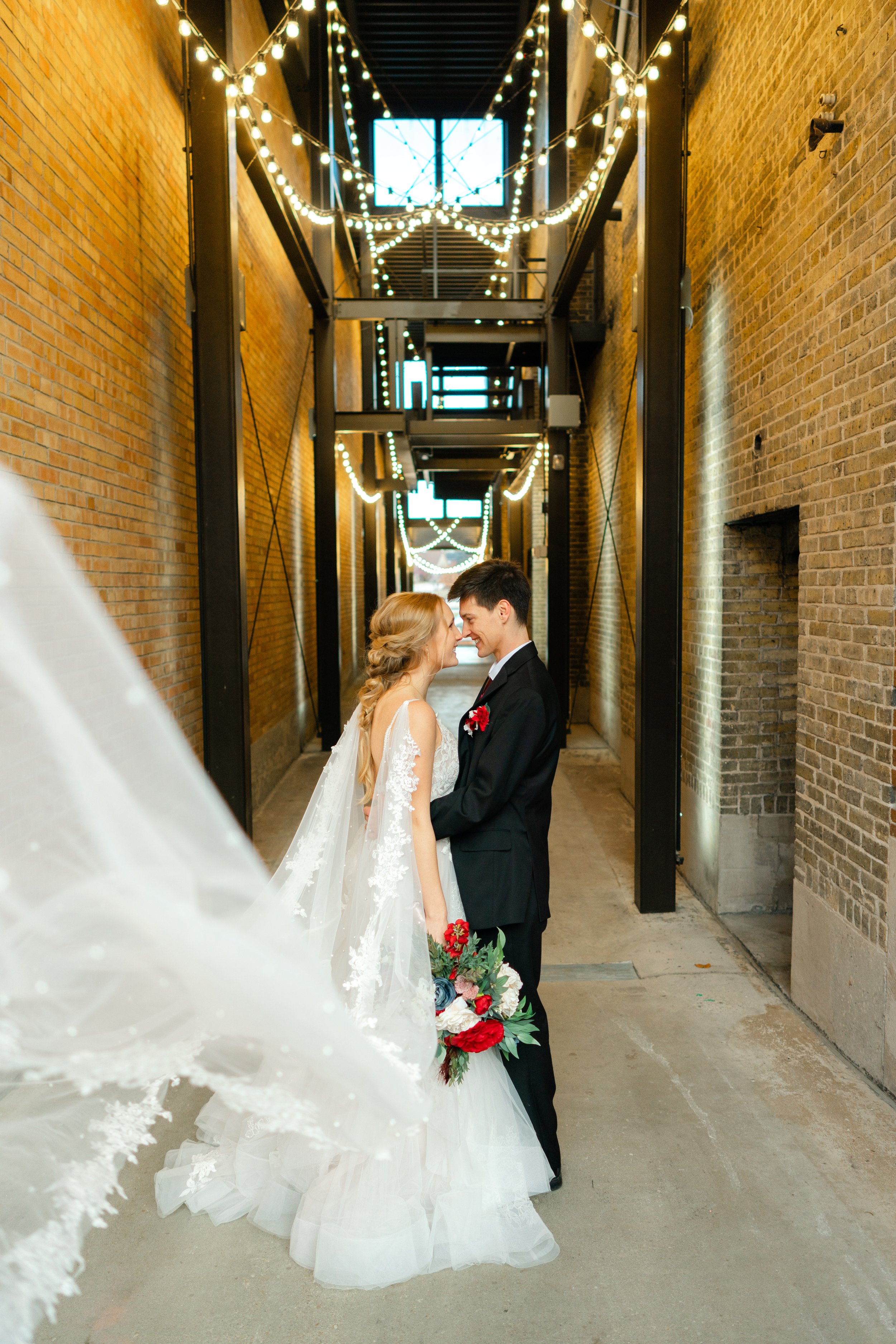 Couple shares a sweet moment in a beautiful alley in West Bend, Wisconsin