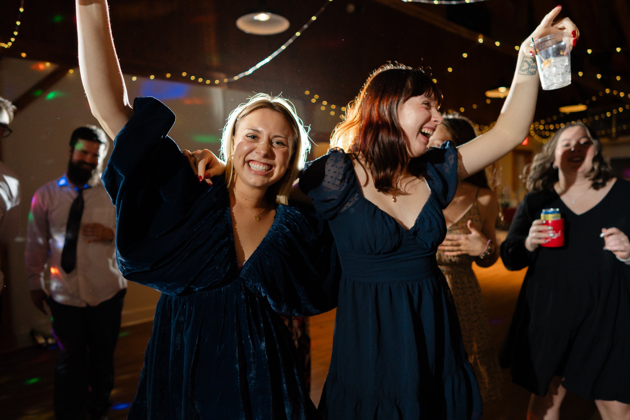 Wedding guests dance with joy at Glacier Hills Hall and Chapel