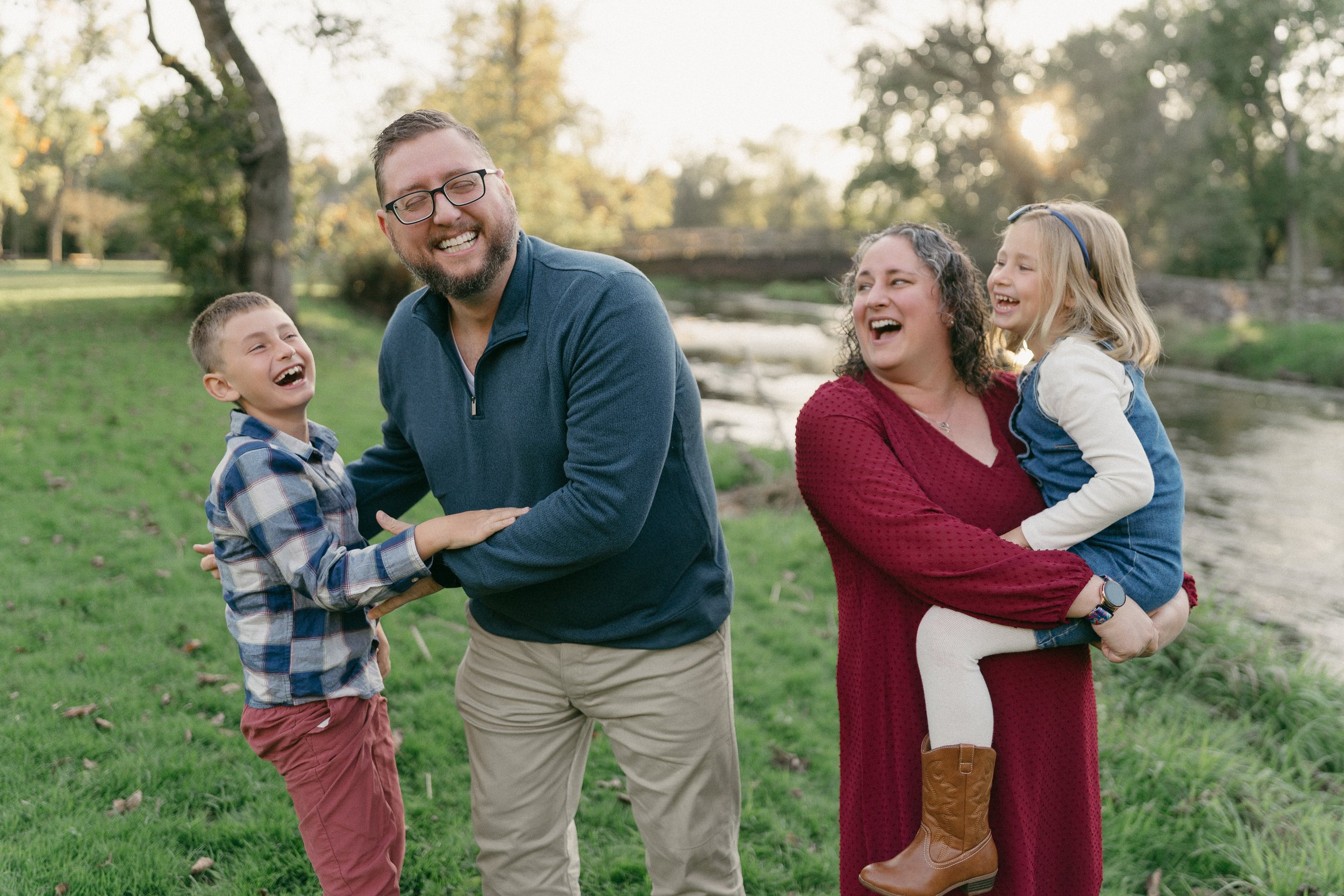 Family portraits in West Bend Wisconsin field at sunset