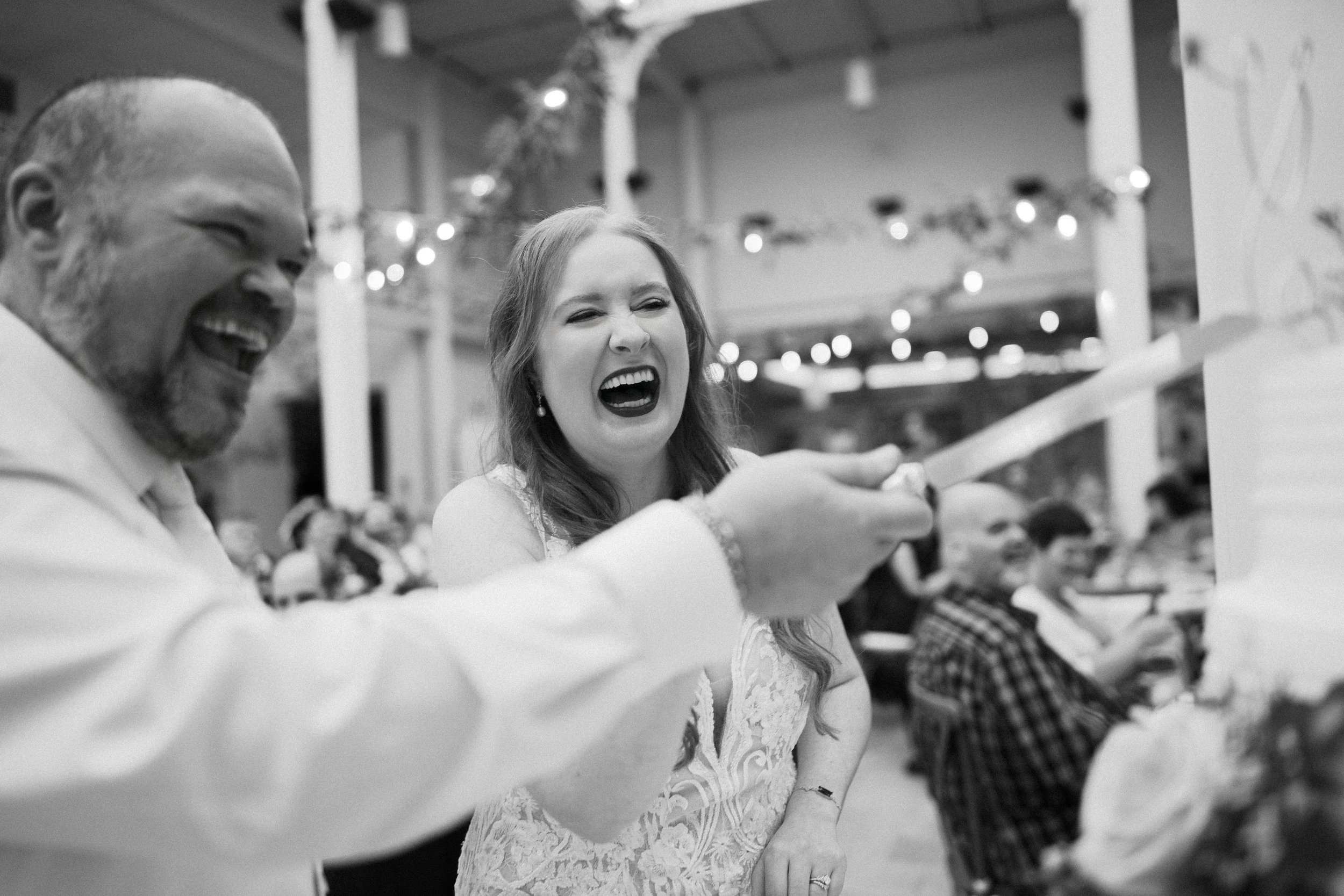 Milwaukee wedding photographer capturing a couple cutting their cake at Boerner Botanical Gardens