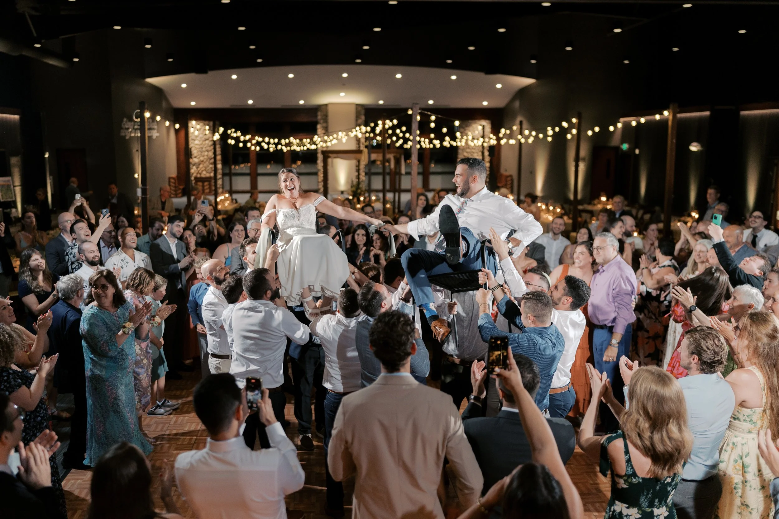 Lively wedding reception dance floor photographed in Milwaukee, Wisconsin