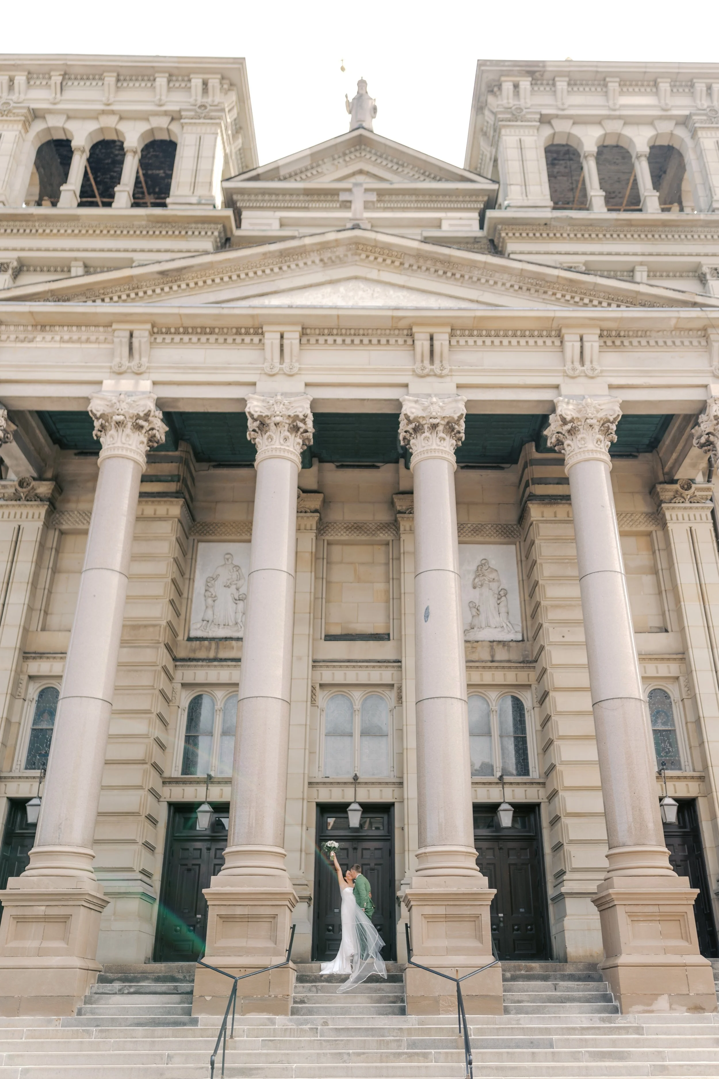 A Milwaukee wedding ceremony ends with a celebratory kiss outside.
