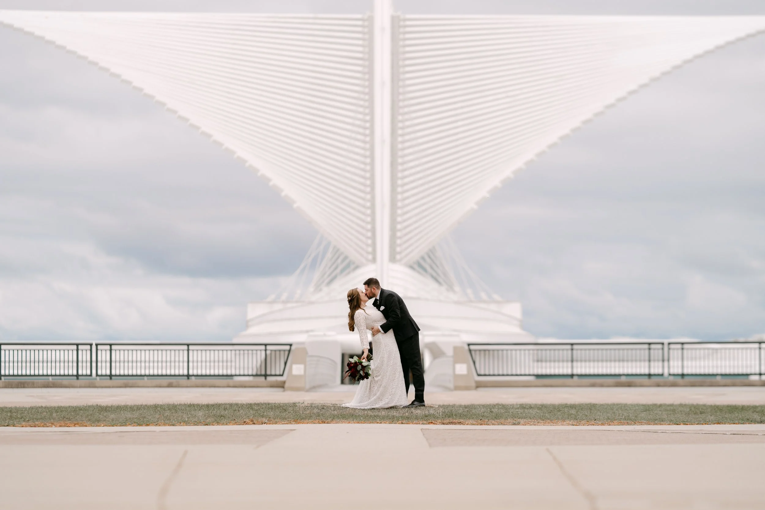 Lakefront wedding photos in Milwaukee with changing weather and natural light