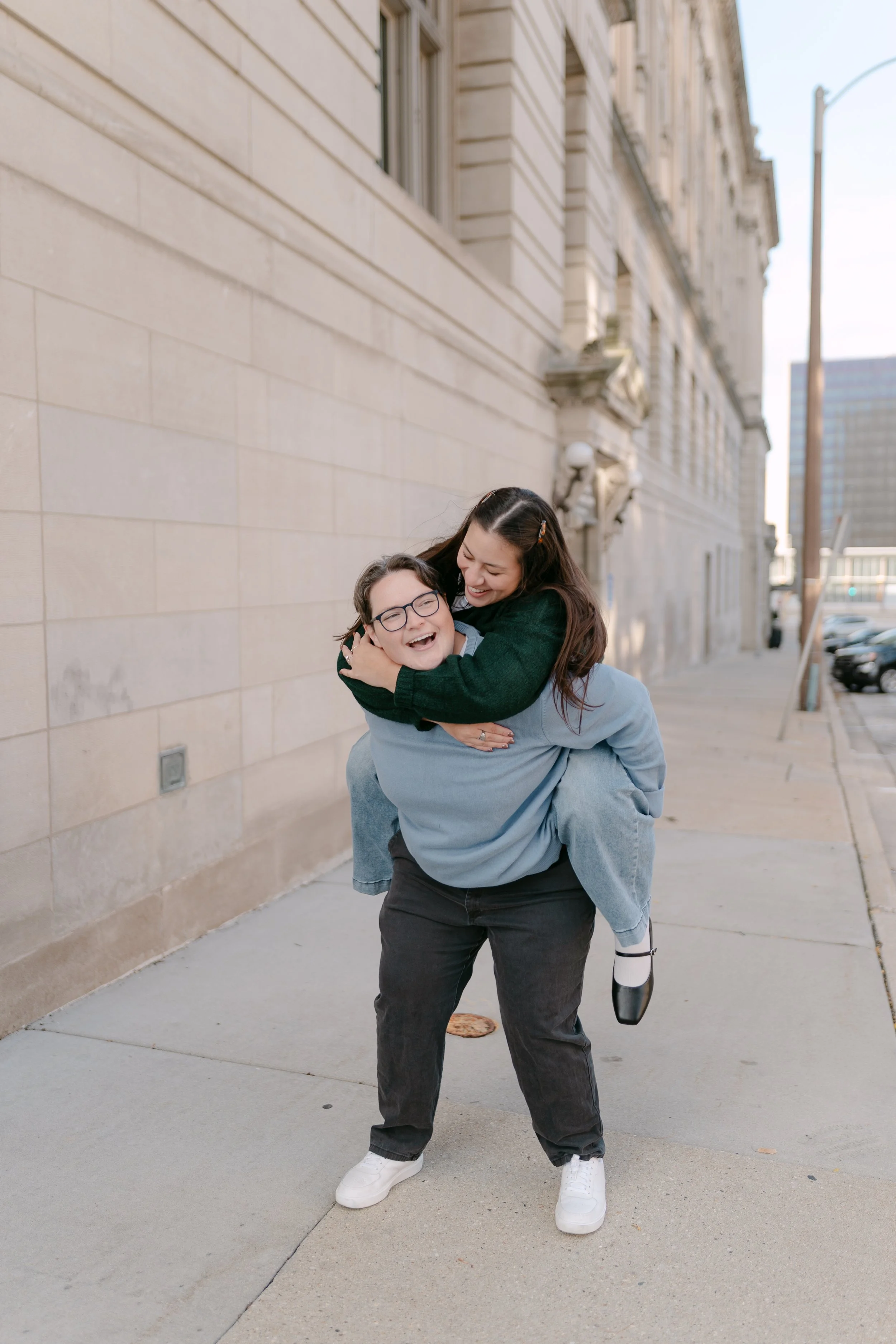 Natural engagement photos focused on connection and movement in Milwaukee