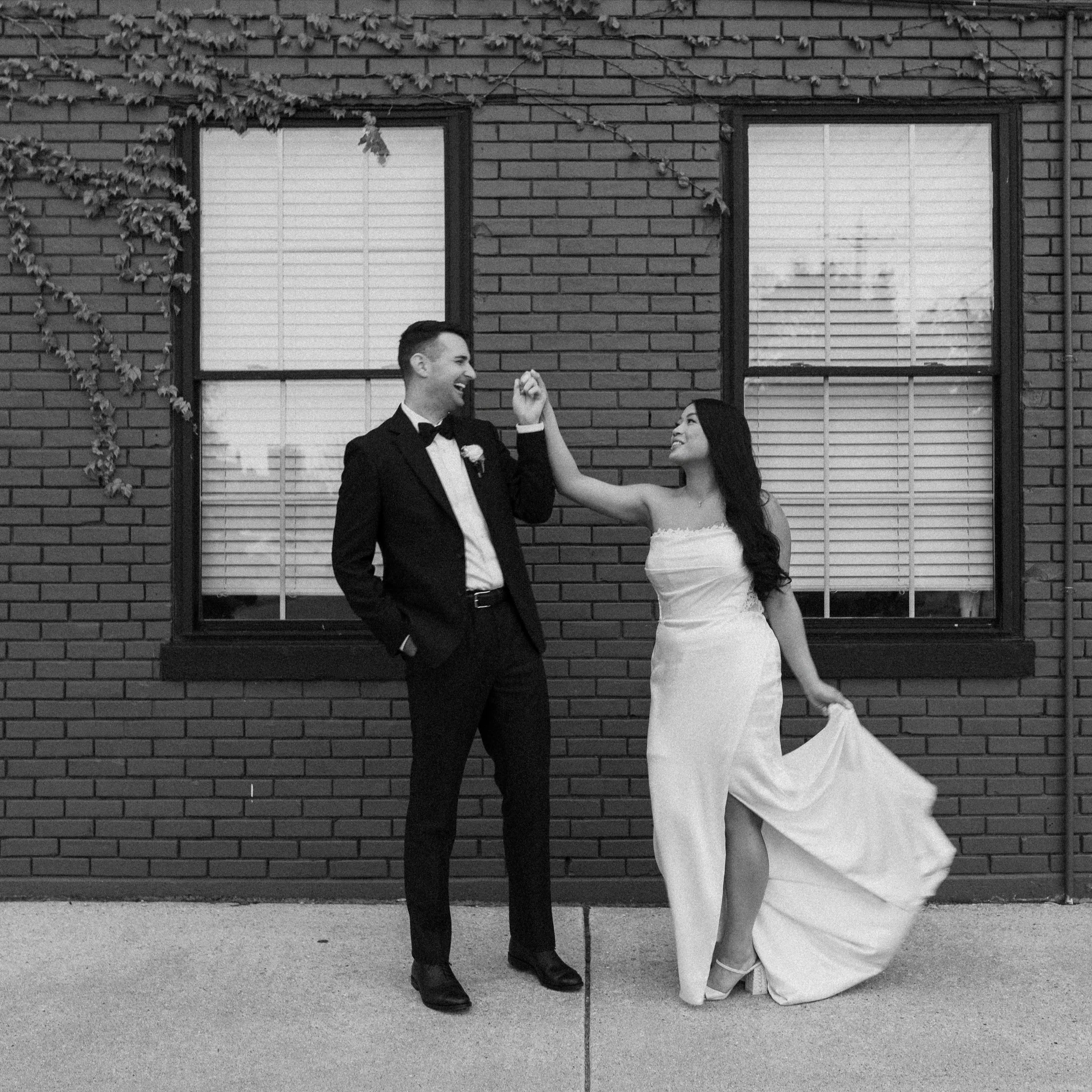 Outdoor wedding portrait of bride and groom at The Ivy House in Milwaukee by Taber Lacie Photo