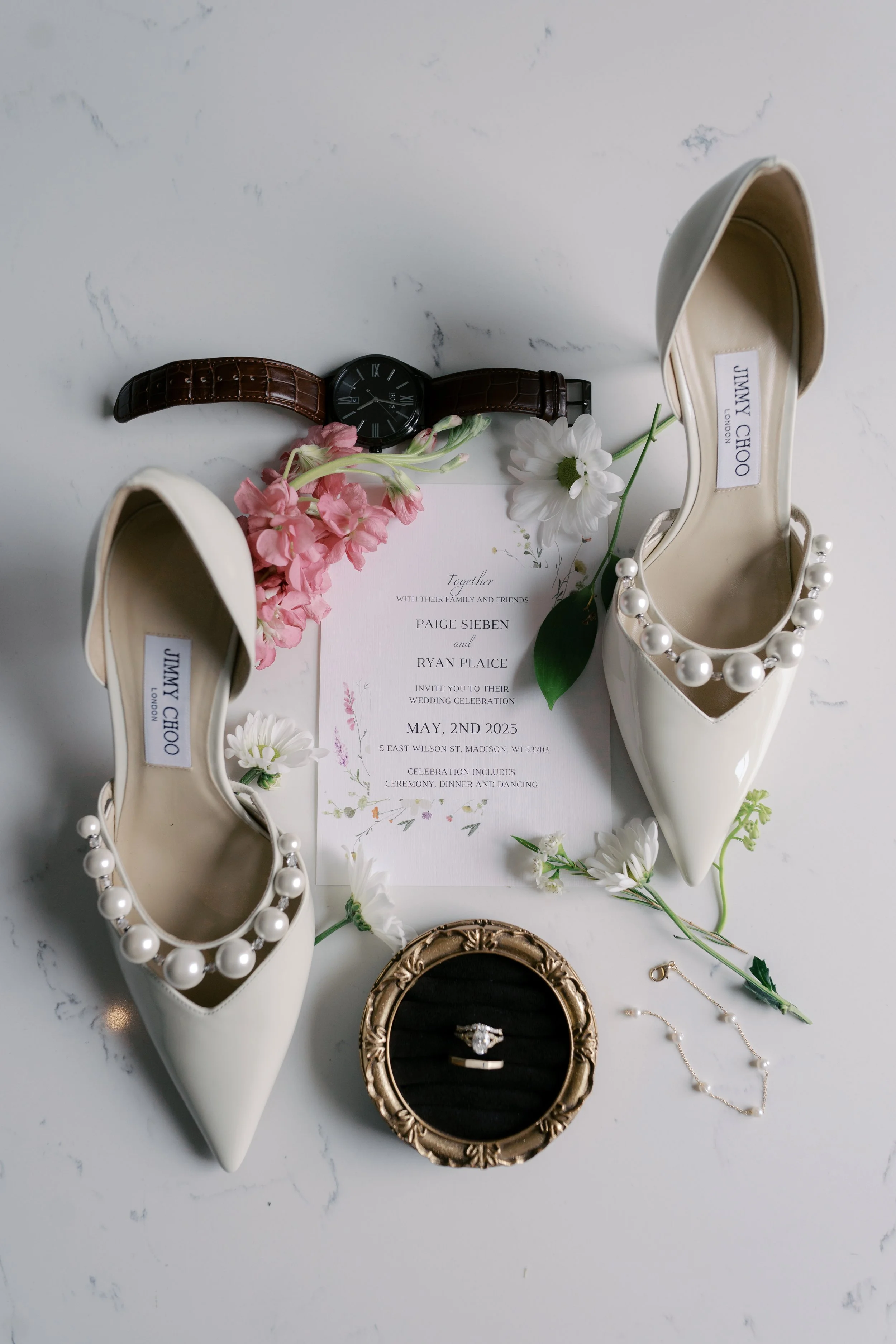 Wedding invitation suite and rings styled flat lay photographed by Milwaukee Wisconsin wedding photographer