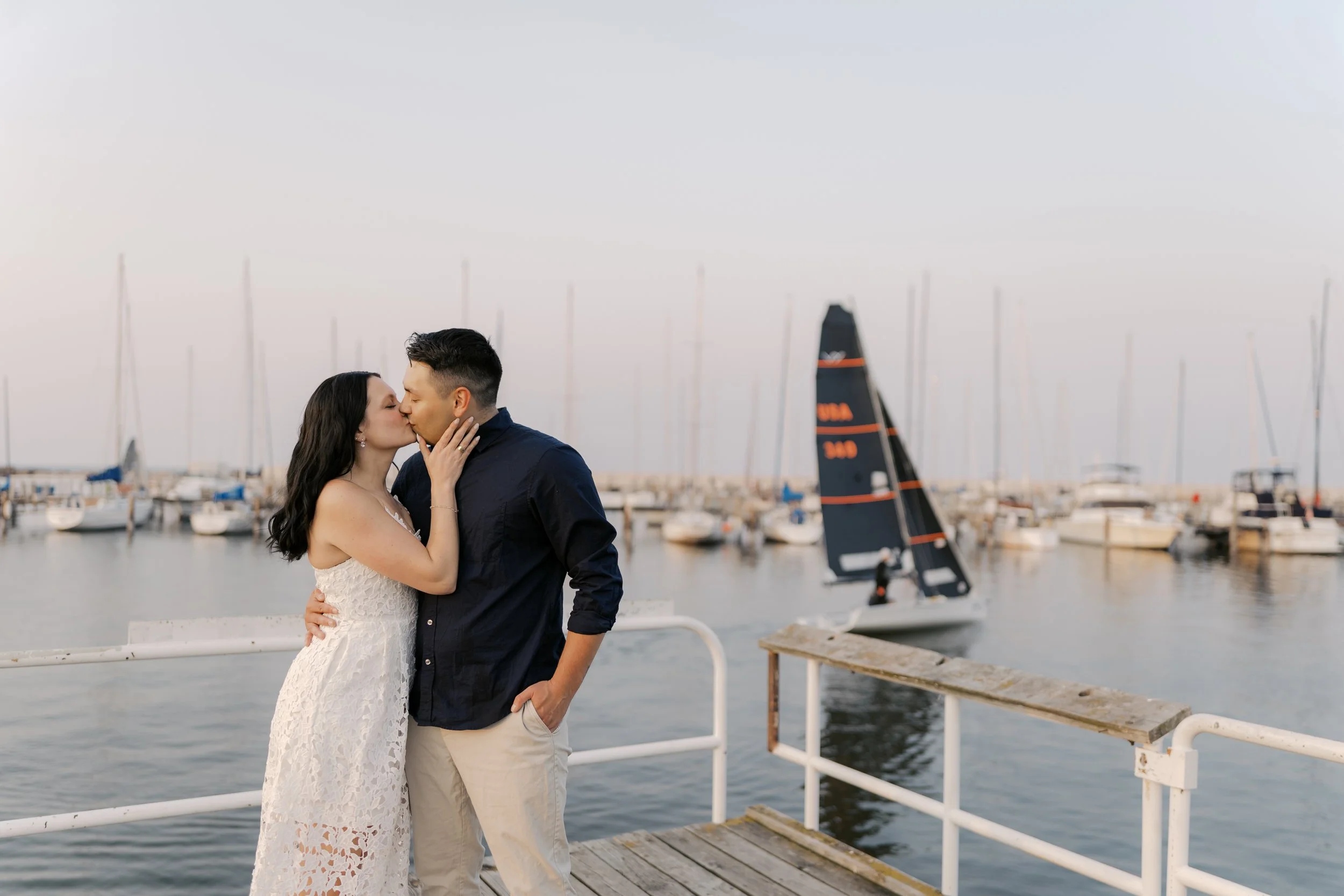 Couple kissing during a Lake Michigan engagement session at sunset in Milwaukee