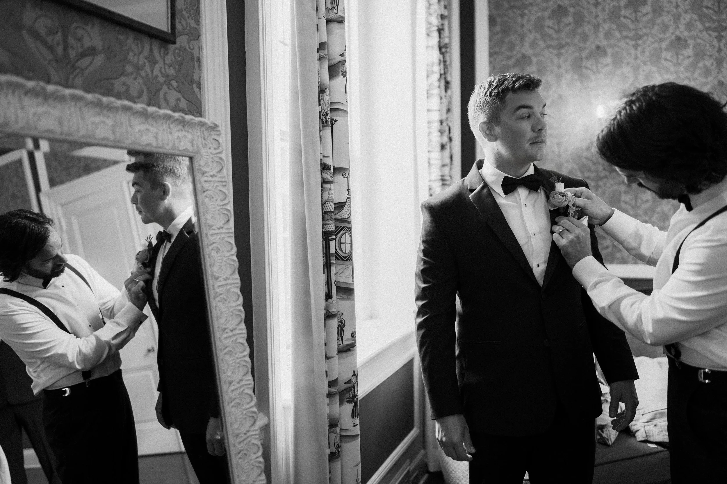 A groom gets ready for his wedding at The Madison Club in Madison, Wisconsin.