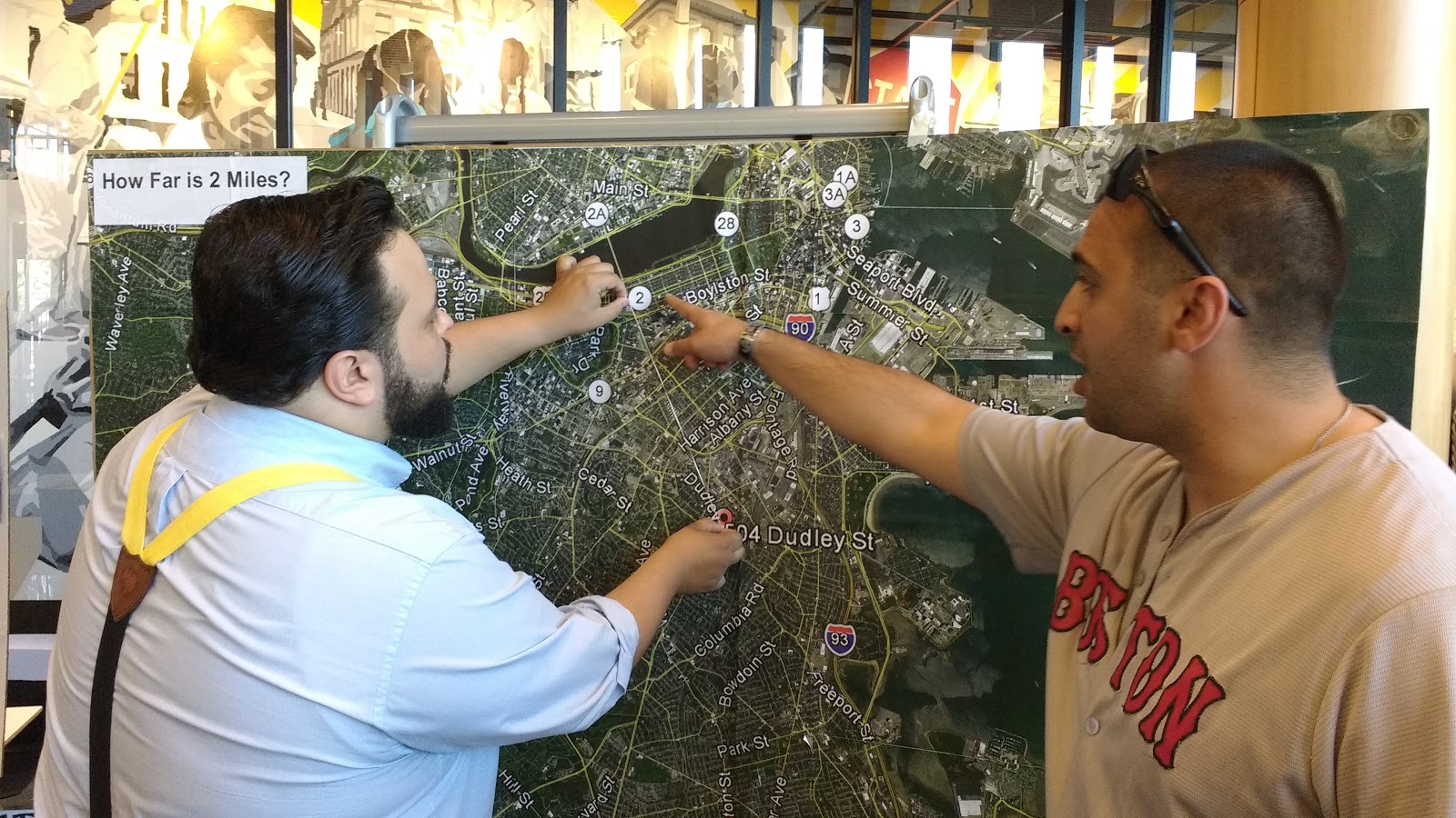 Jeff Rogers (left) and MBTA Officer Christopher Ducharme (right) see how far 2 miles really is.