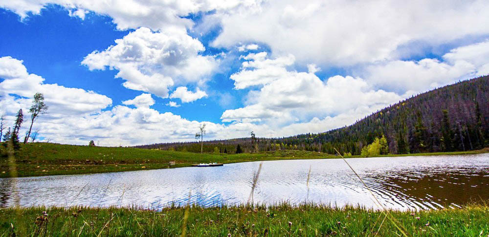 Calm-Mountain-Pond-on-Shadow-Creek-Ranch-Property-in-Silverthorne-Colorado.jpg