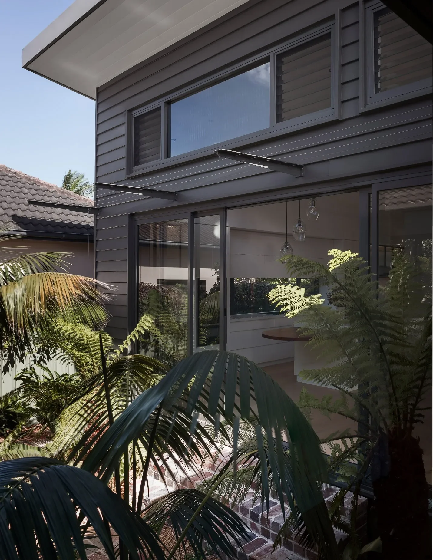 Garden courtyard connecting old and new house