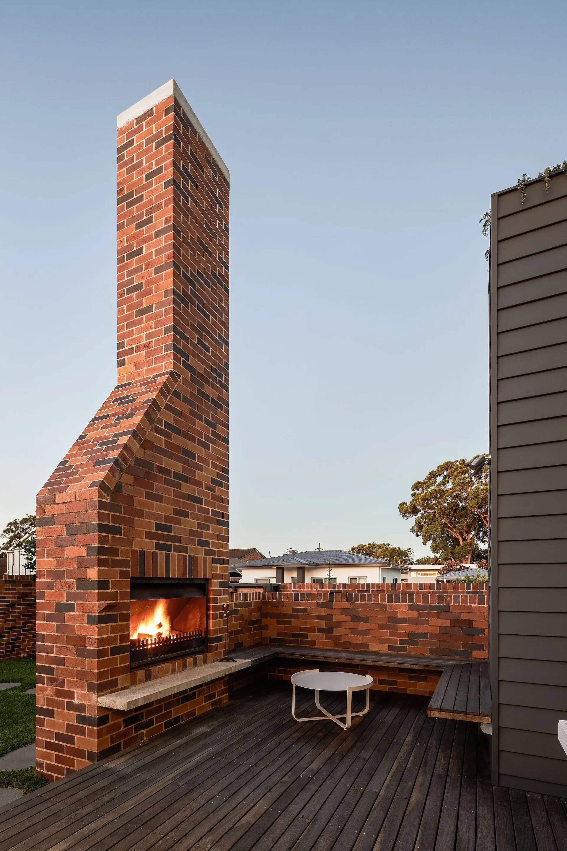 Outdoor brick fireplace in contemporary home
