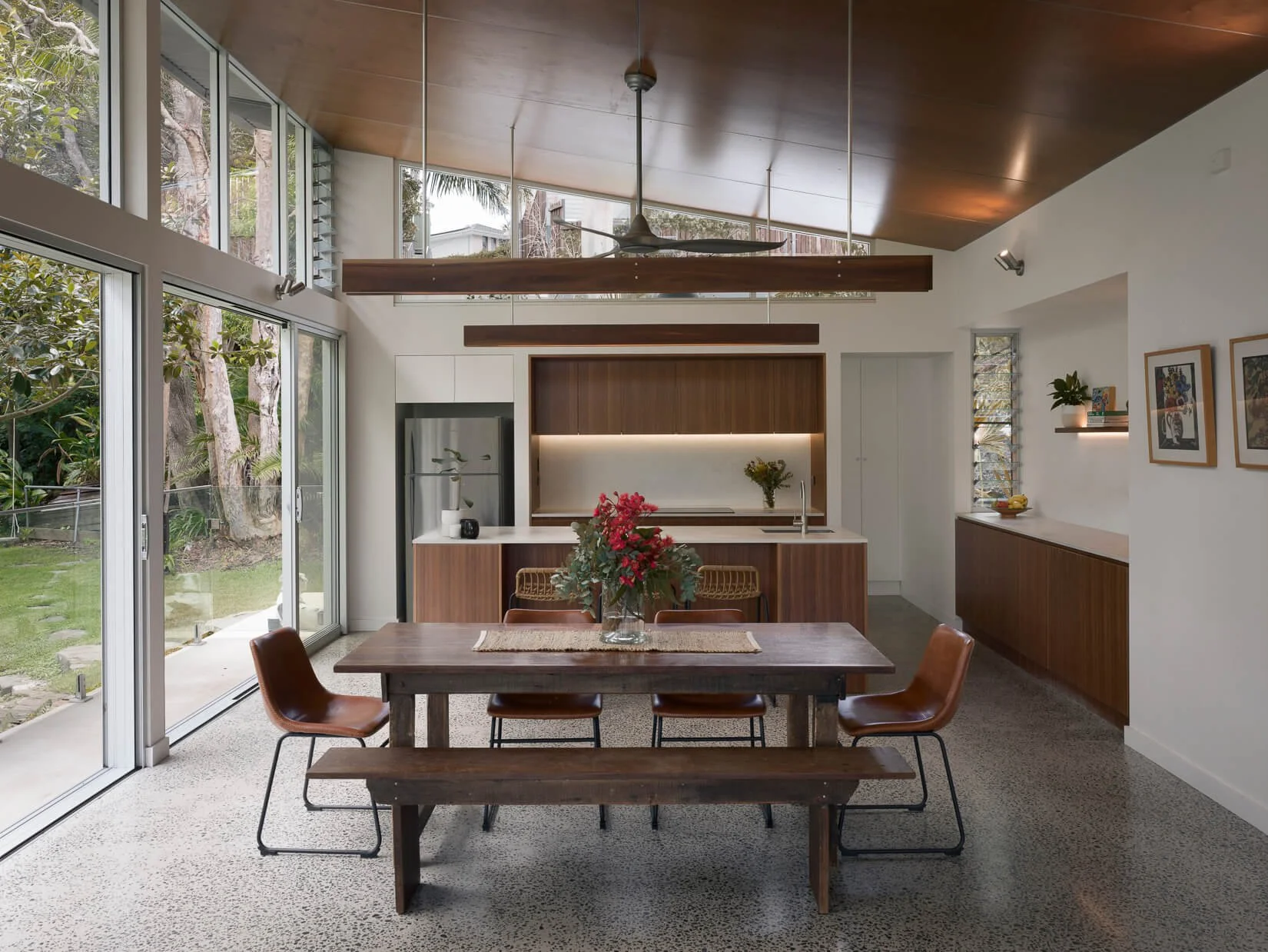 Open plan dining space in Castle Cove home with indoor outdoor living connection