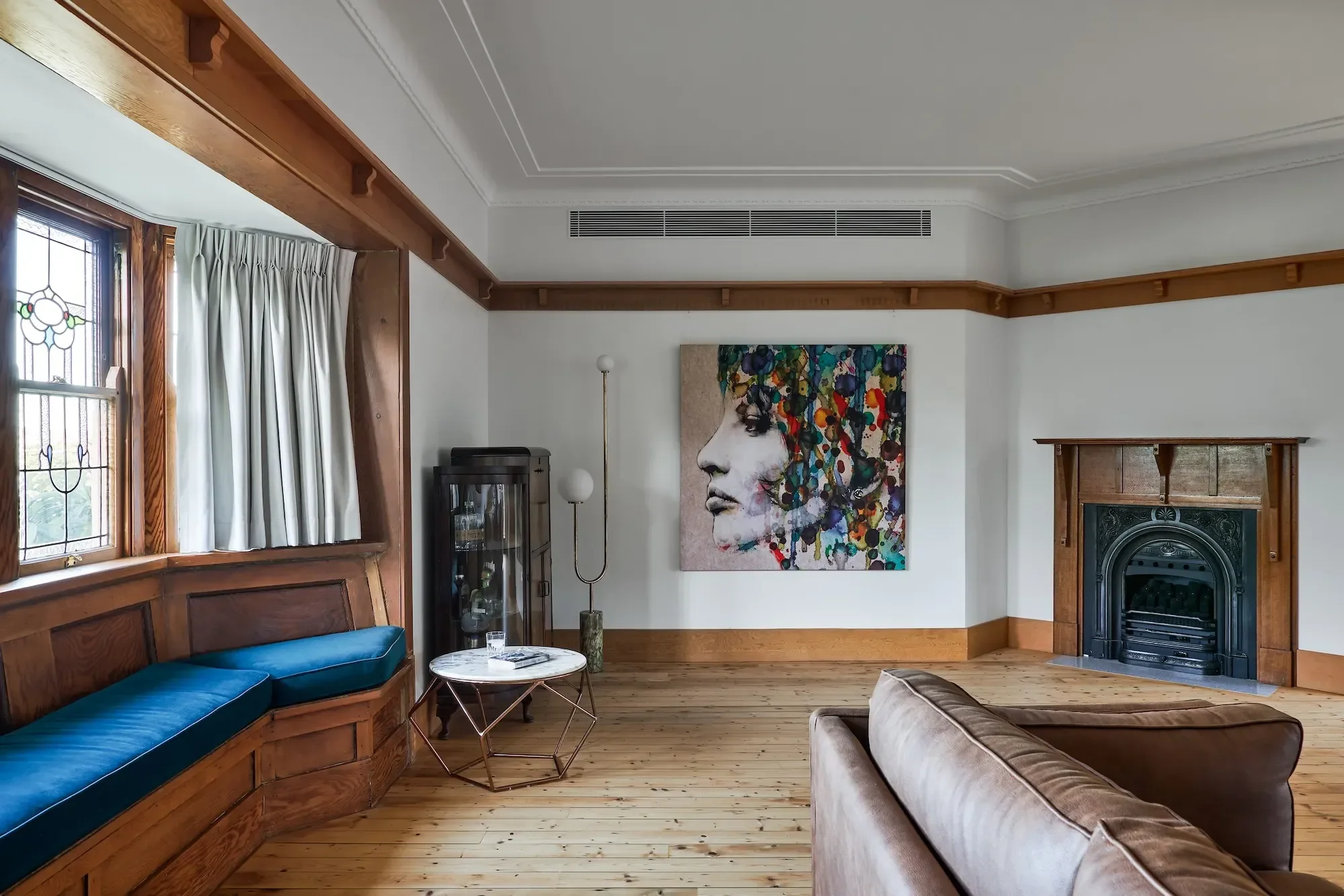 Living room renovation in Roseville Sydney with natural materials and fireplace