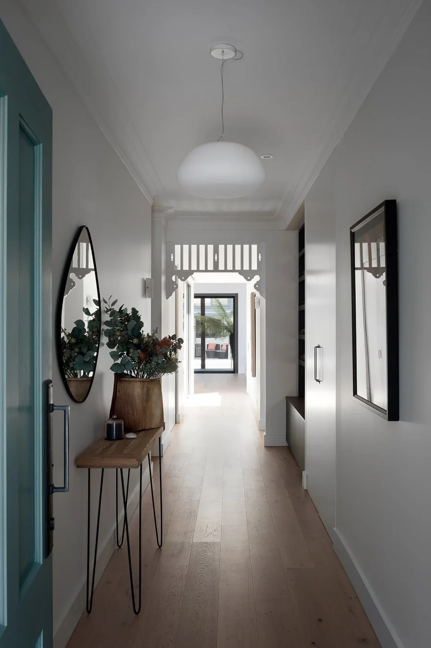 Light-filled hallway with heritage detailing and modern finishes in an East St Ives home.