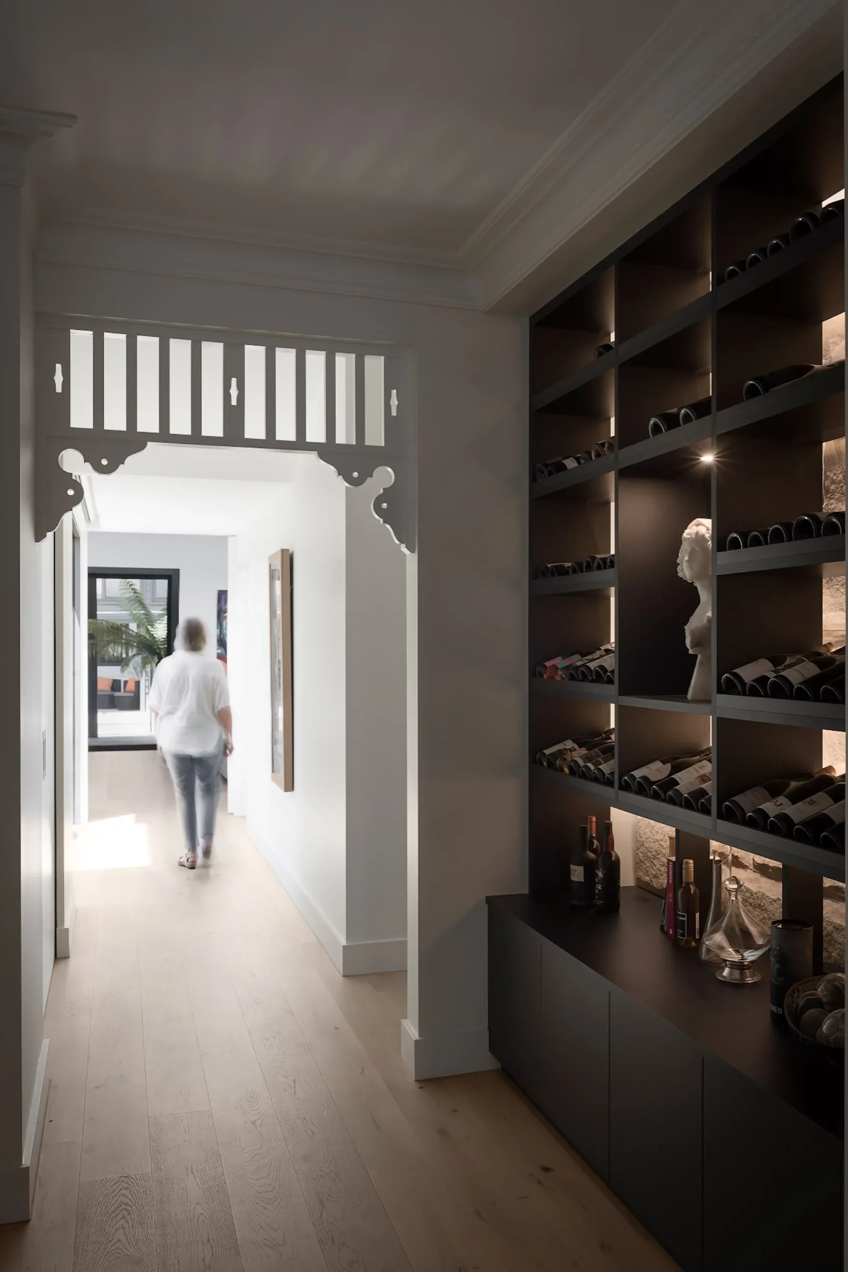 Hallway with custom storage and shelving in an architect-designed Gordon residence