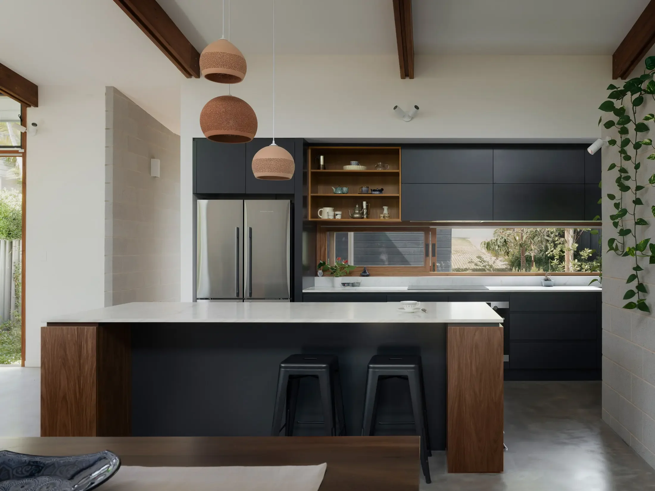 Passive design kitchen with timber beams at Beela House