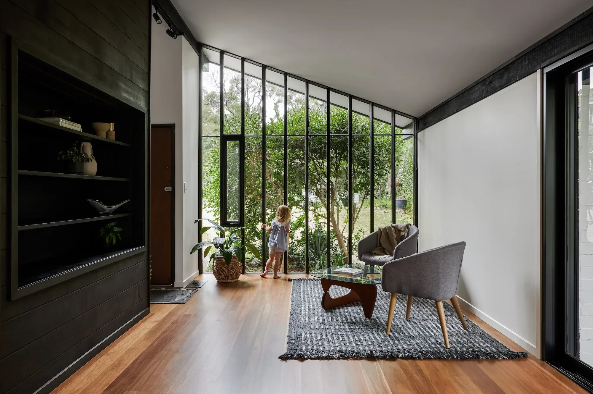 Pettit and Sevitt living space with large glazing in home heritage renovation