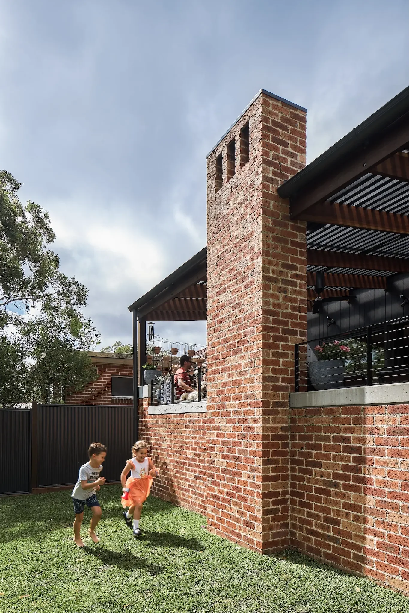 Outdoor seating area with brick fireplace