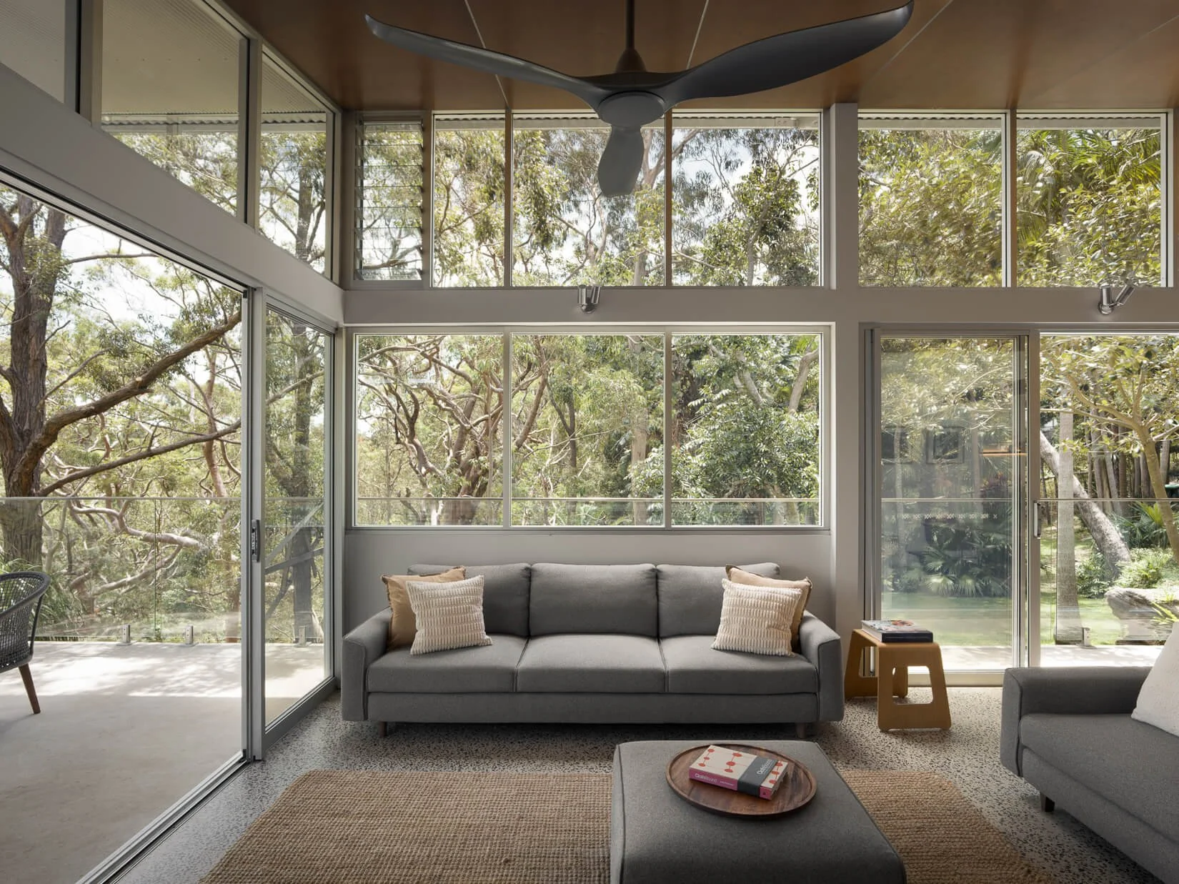 Glass living room overlooking bushland Avalon Beach