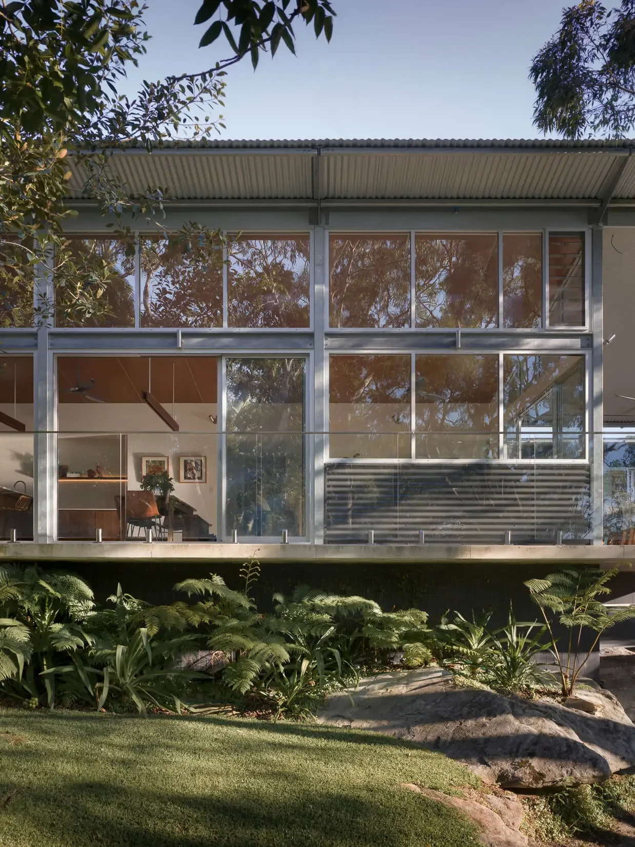 Glazed facade overlooking bushland at Alcheringa House residential architecture in Sydney